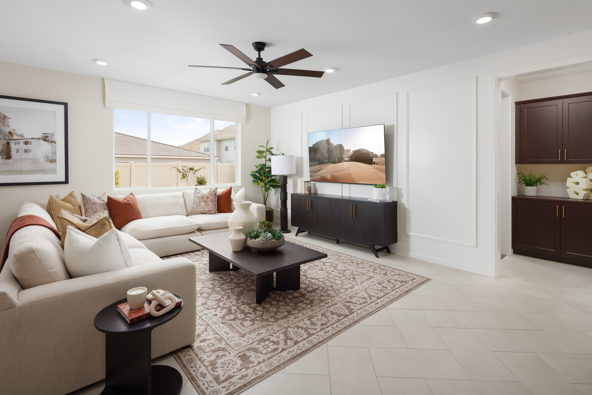 great room with large window and neutral floors