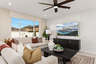 great room with neutral floors and large windows