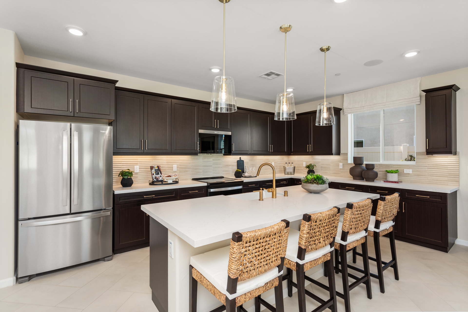 kitchen with dark cabinets and large island