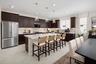 kitchen with dark cabinets and large island