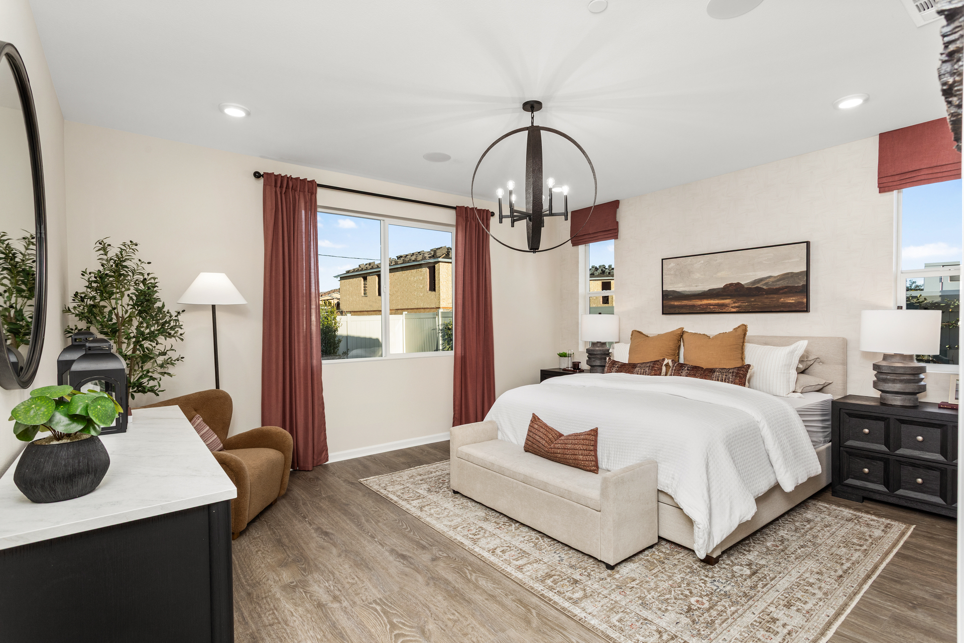 primary bedroom with neutral floors and large windows