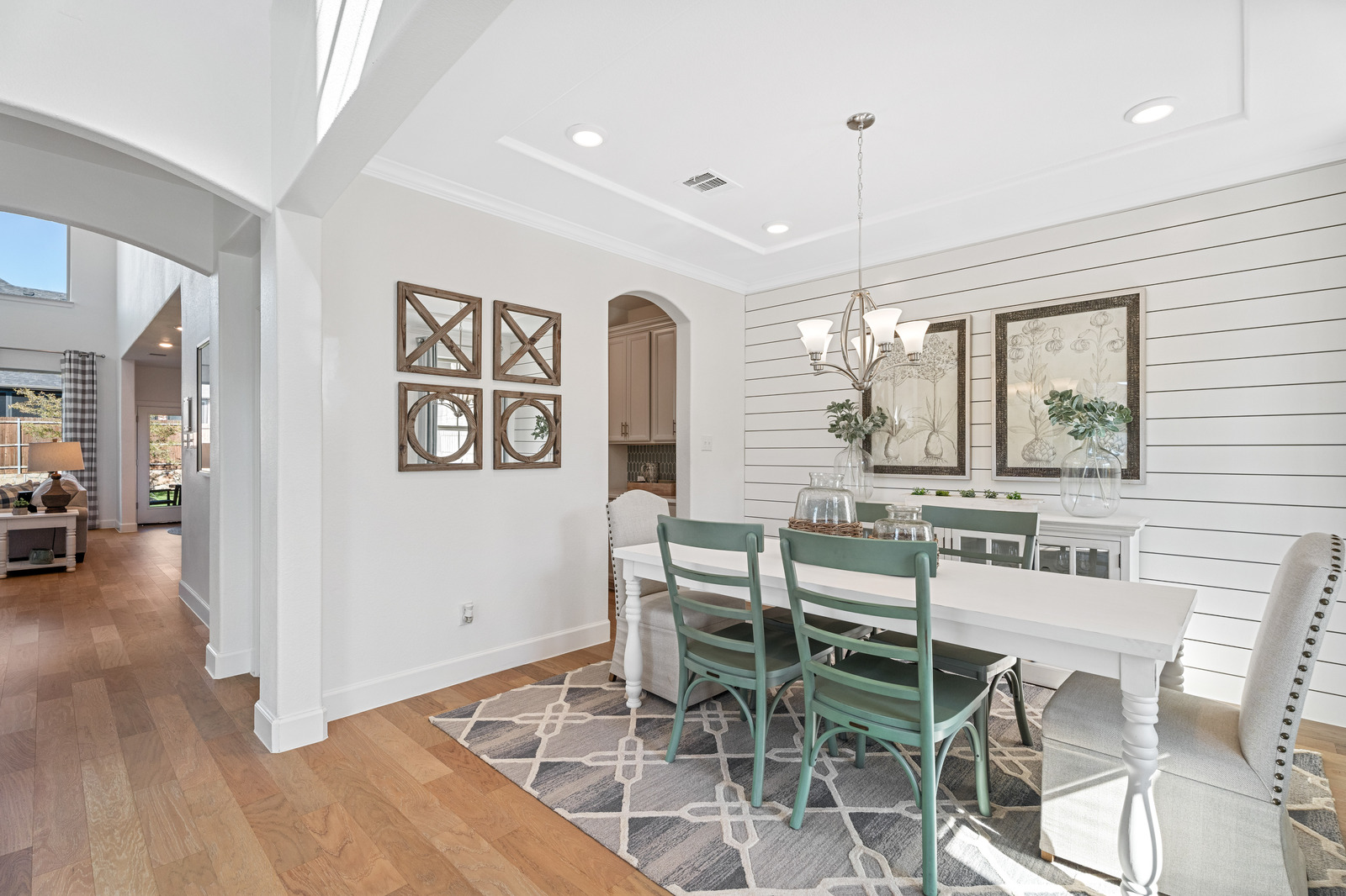 dining room with wood floors and recessed lighting
