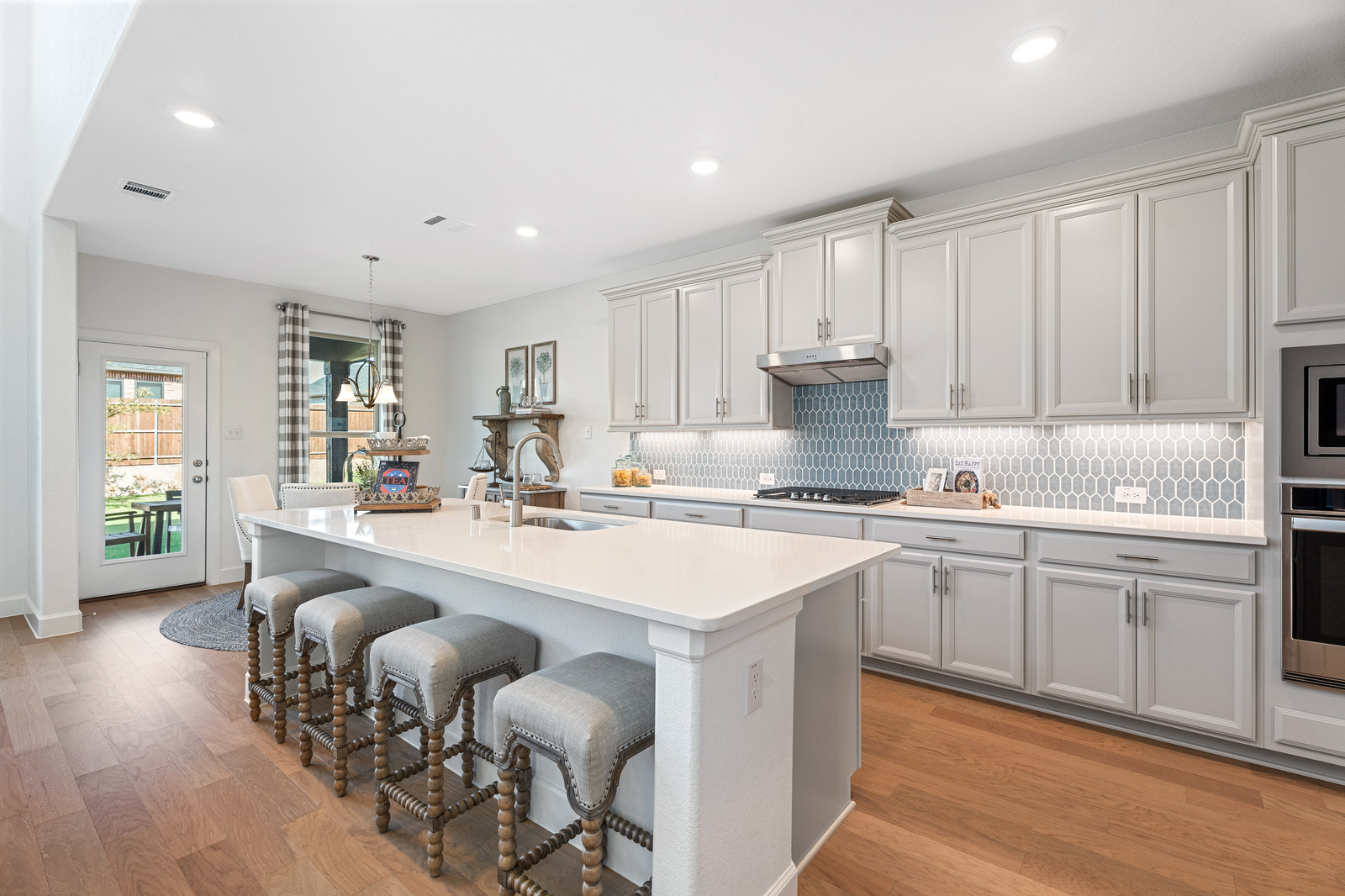 open kitchen with large island and wood floors