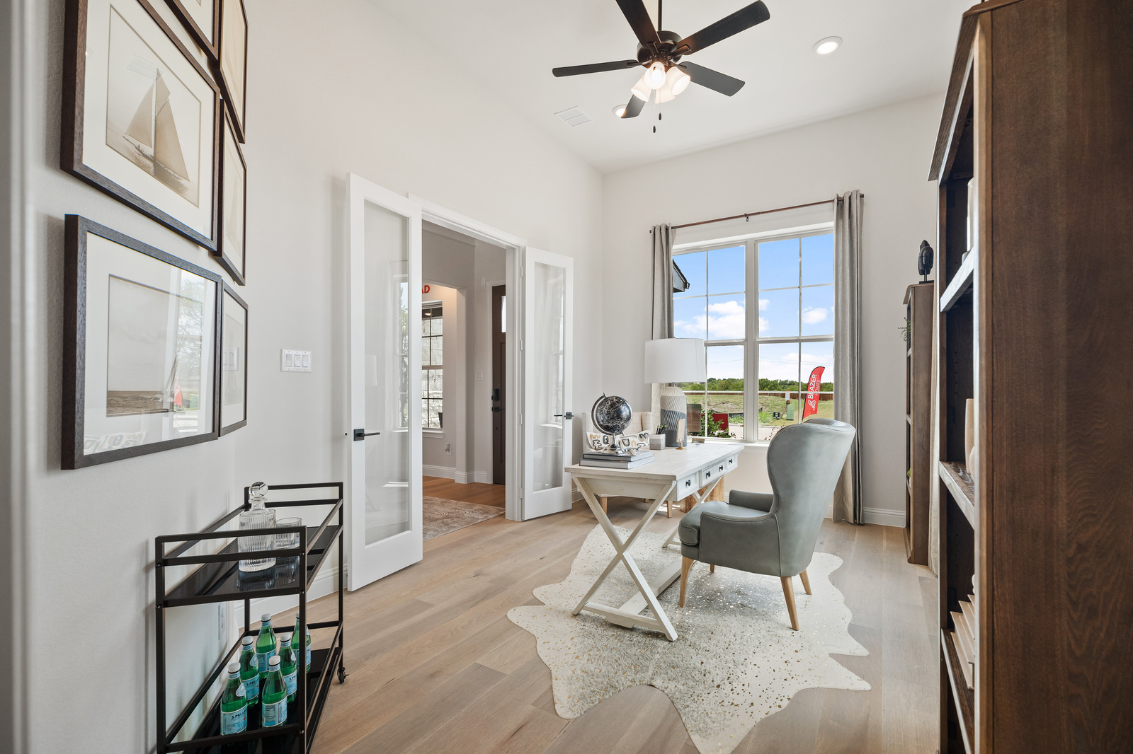 private study with french doors and wood floors
