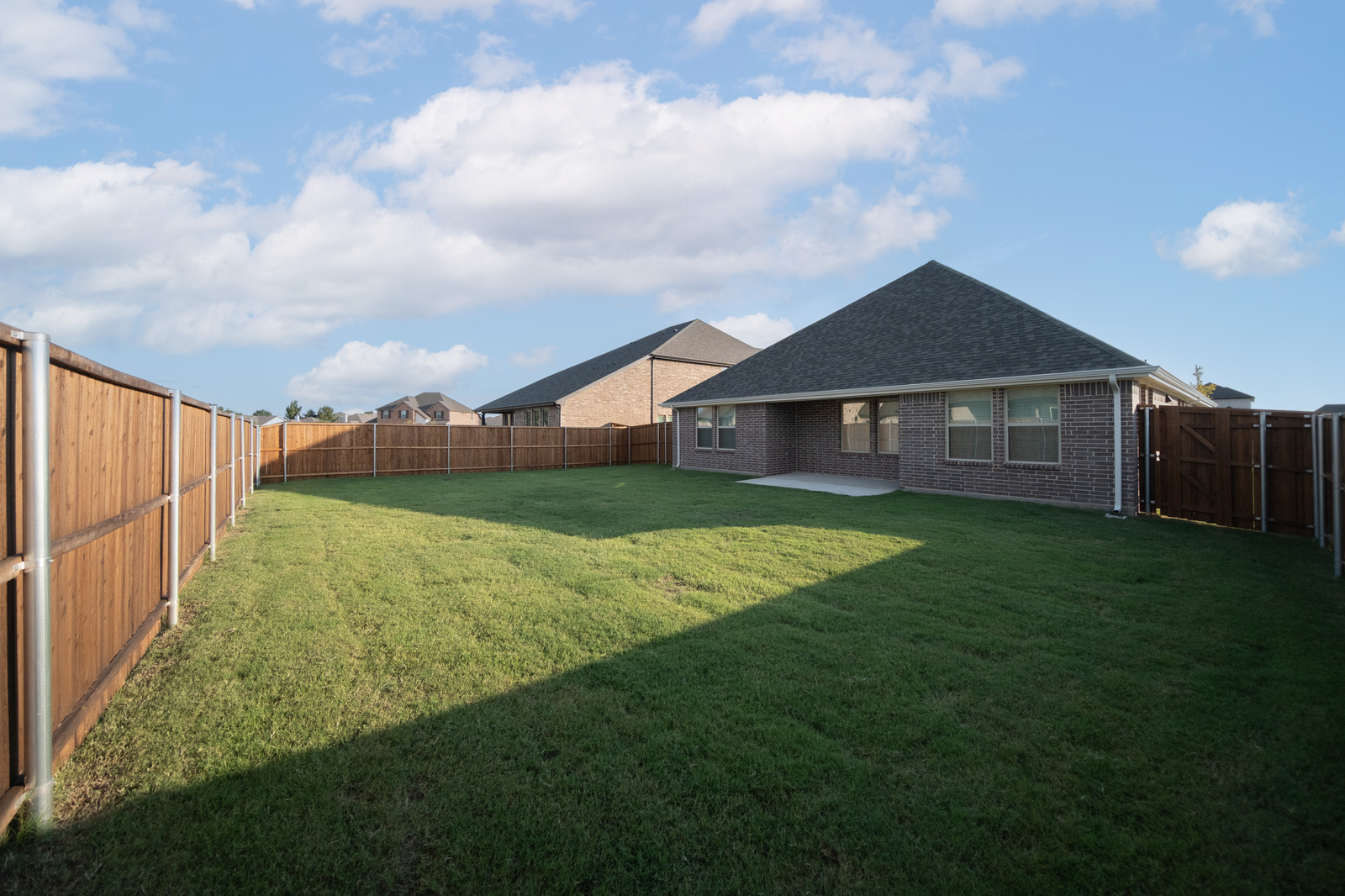 backyard of home with covered patio