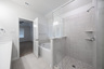 primary bathroom with separate walk-in shower and soaking tub