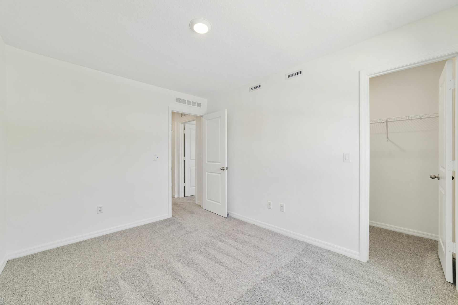 carpet throughout with single window and access to the closet