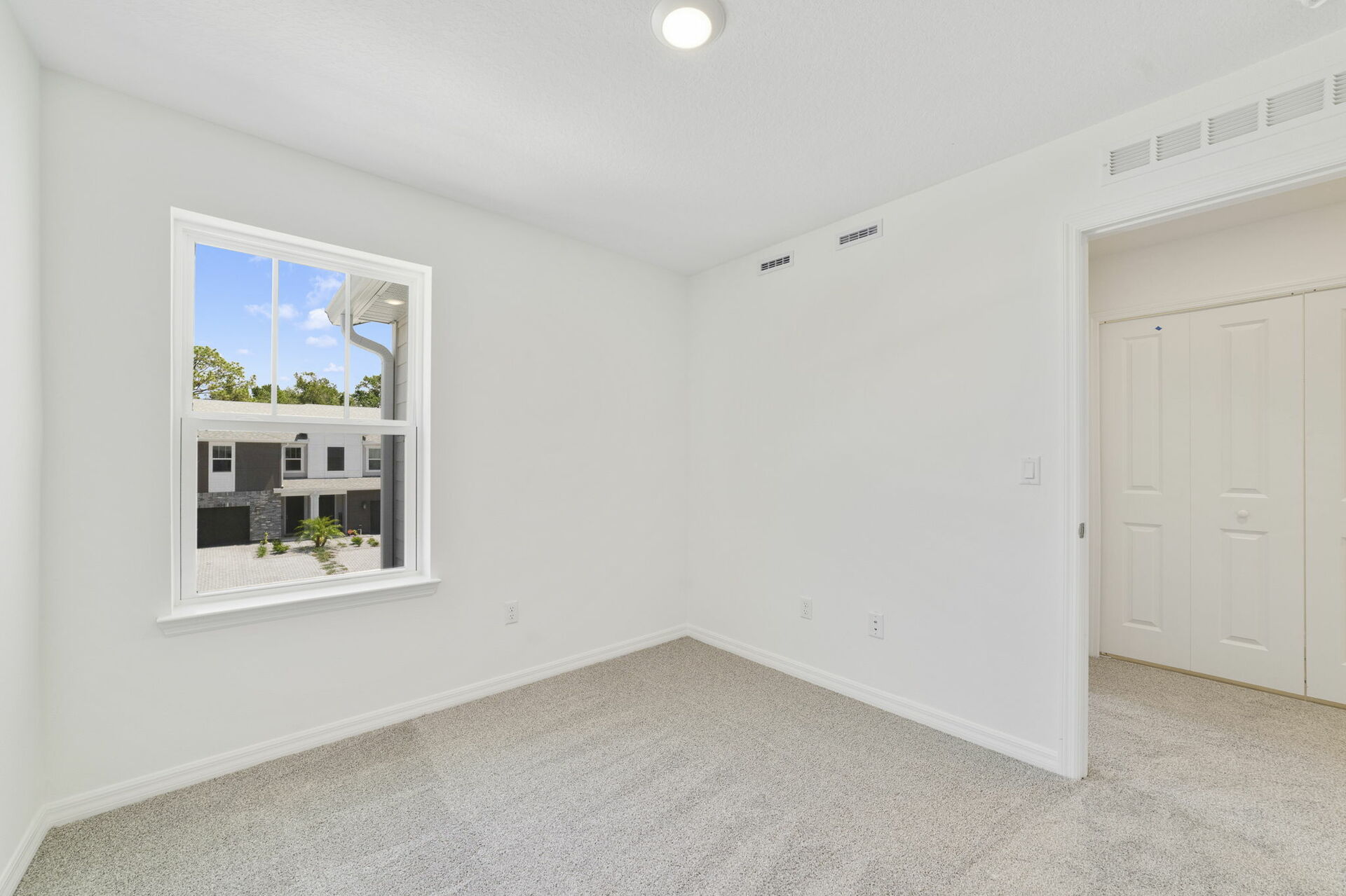 carpet throughout with a single window