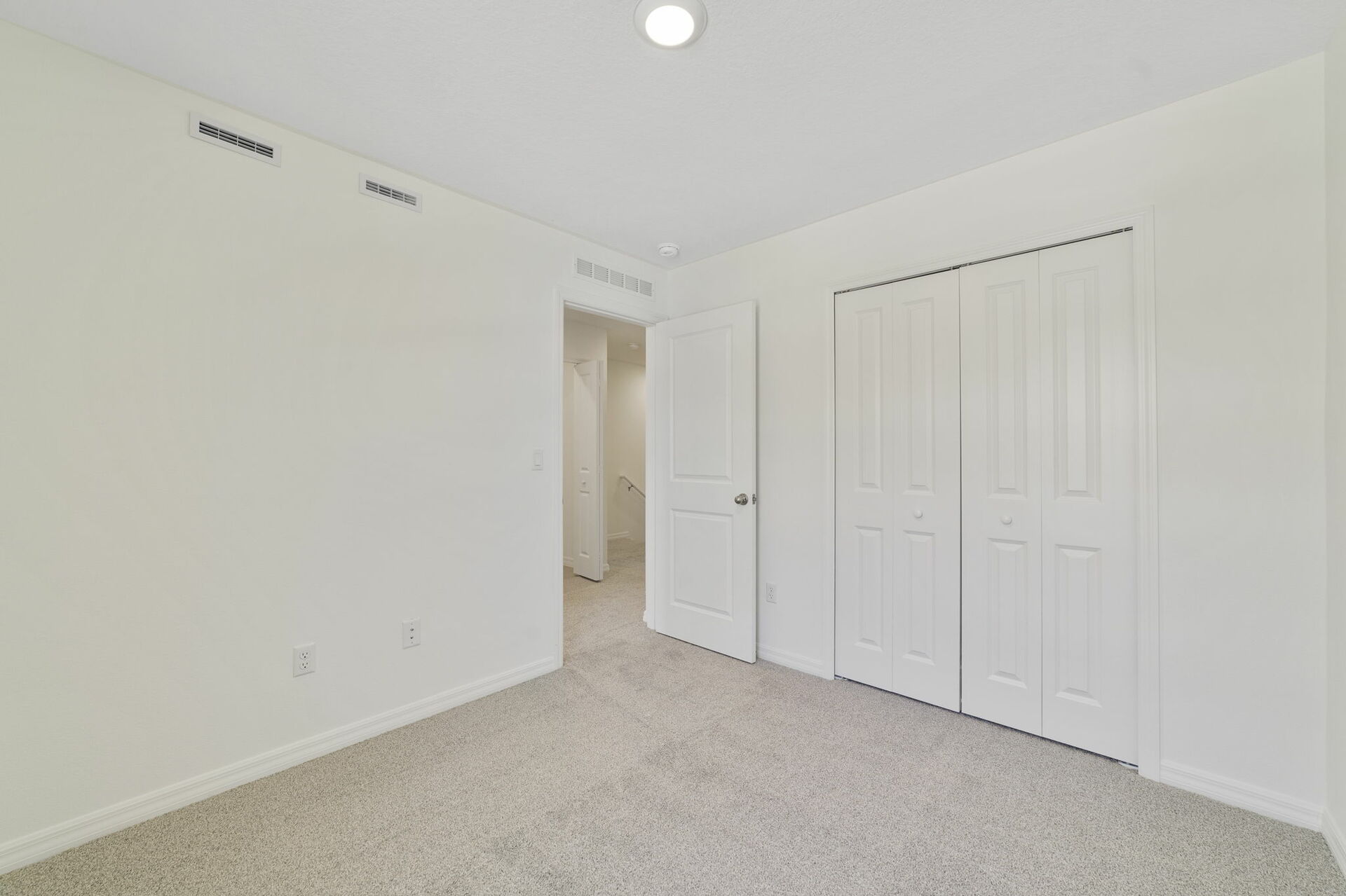 carpet throughout with a single window