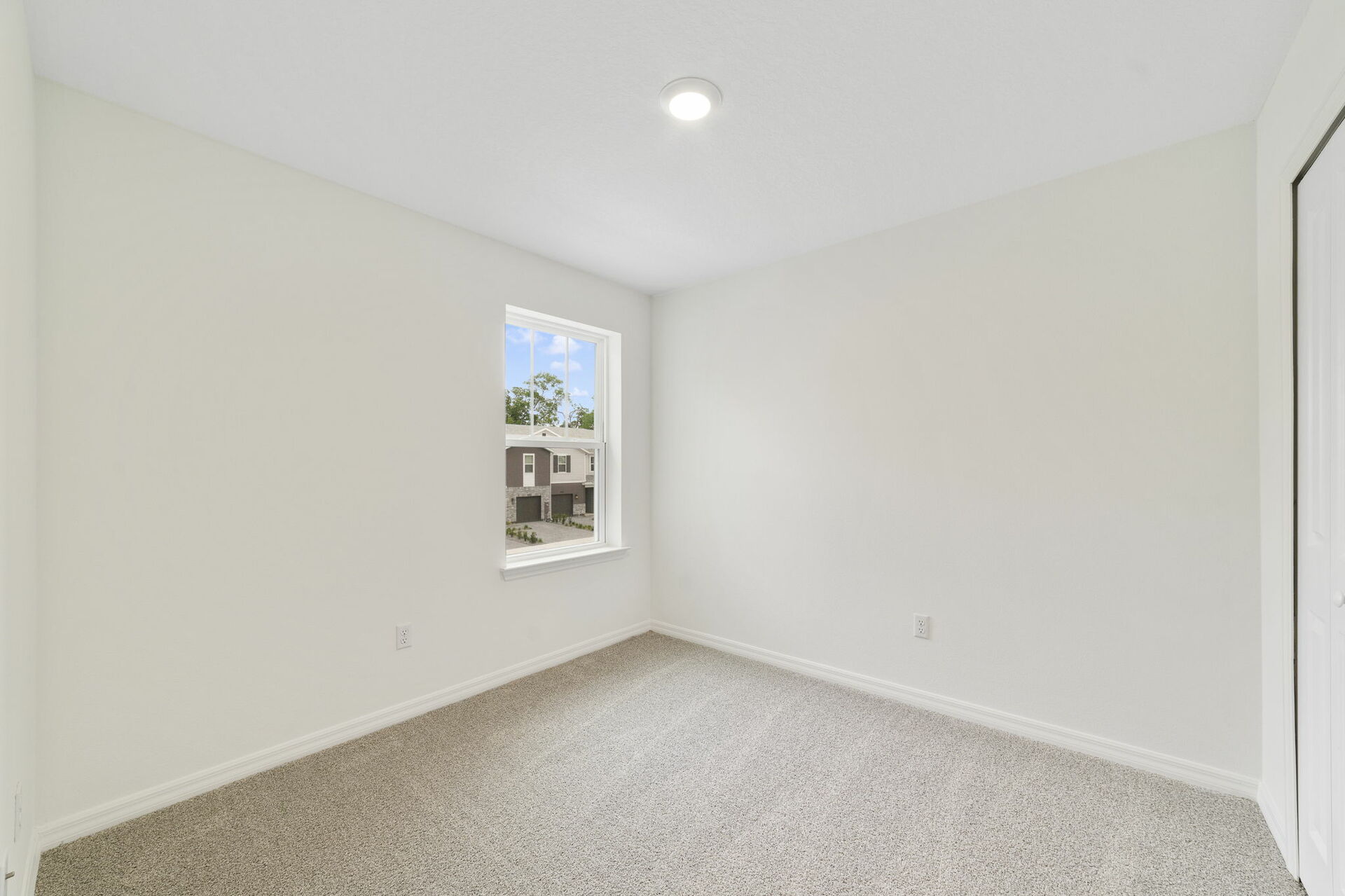 carpet throughout with single window and closet