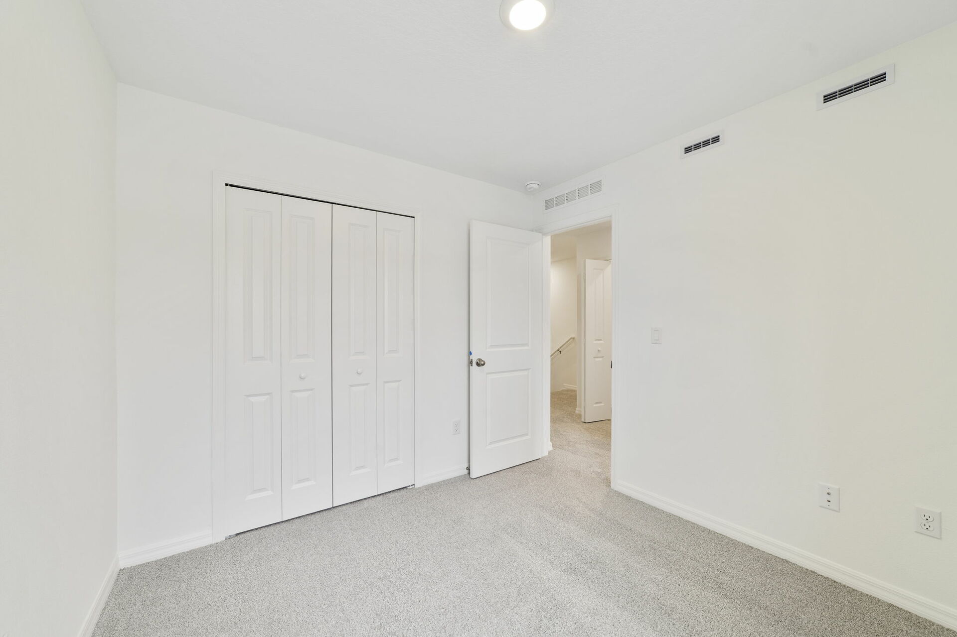 carpet throughout with single window and closet