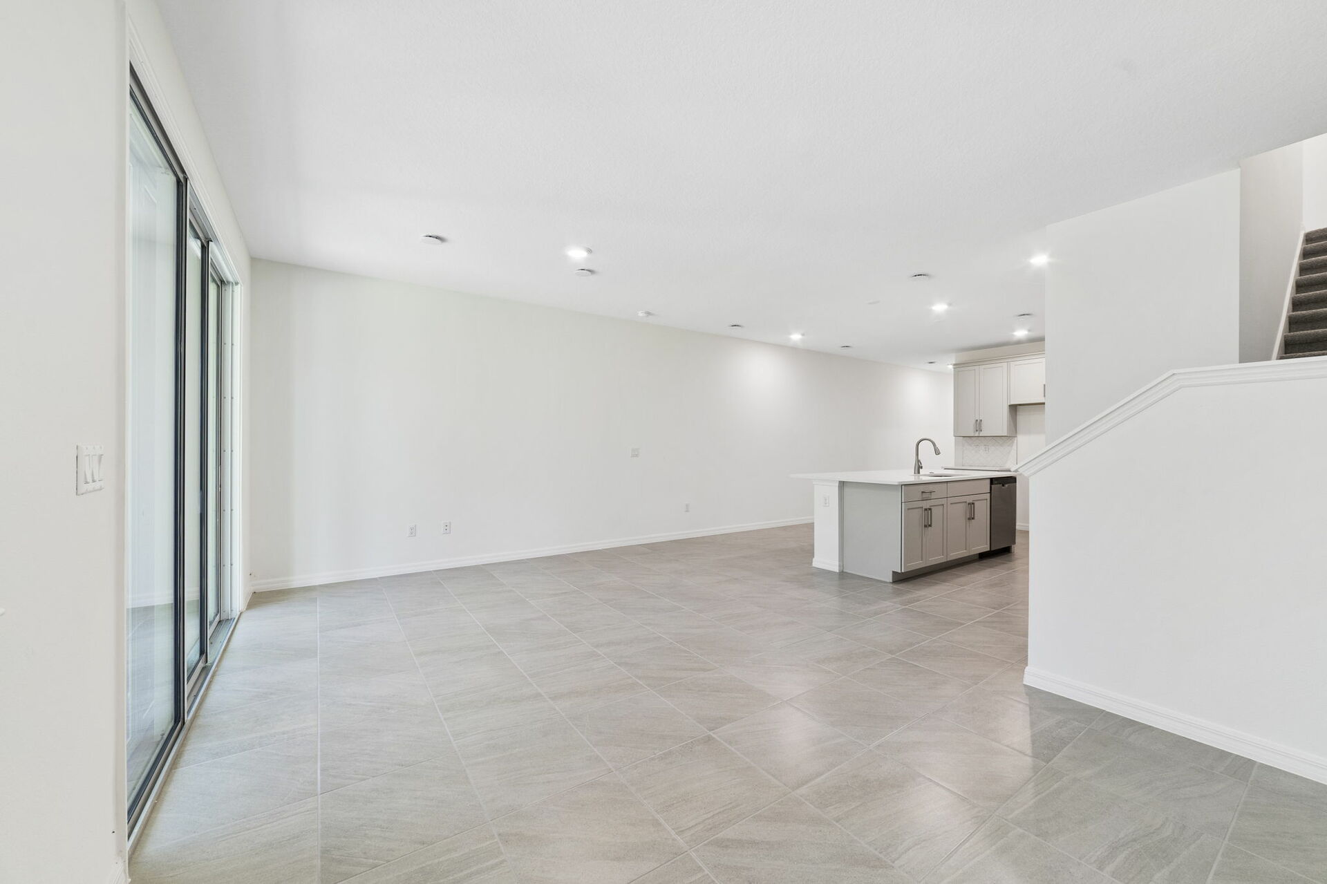 great room with access to lanai and view of the kitchen