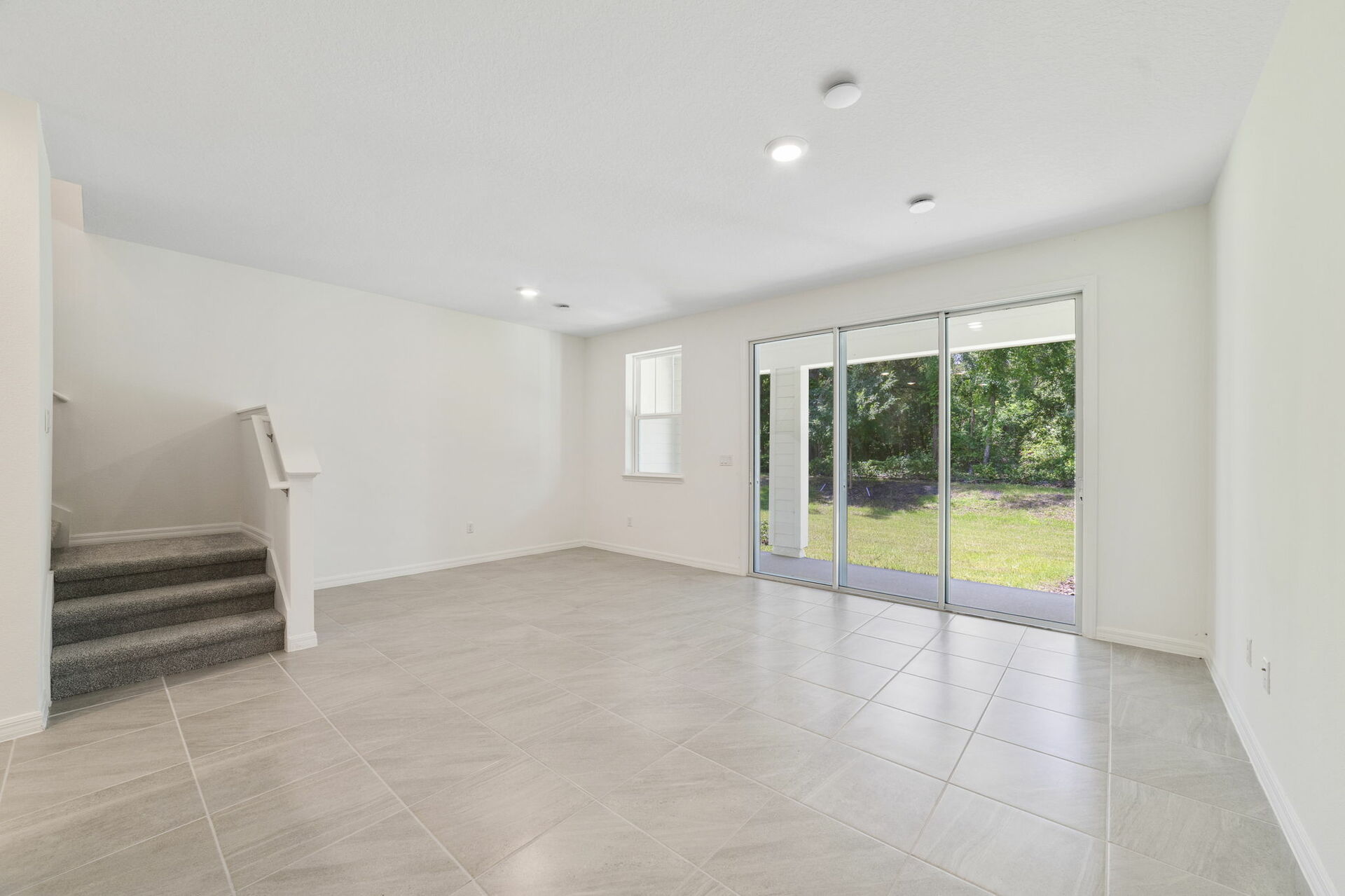 great room with access to lanai and view of the kitchen