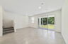 great room with access to lanai and view of the kitchen
