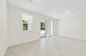 great room with access to lanai and view of the kitchen