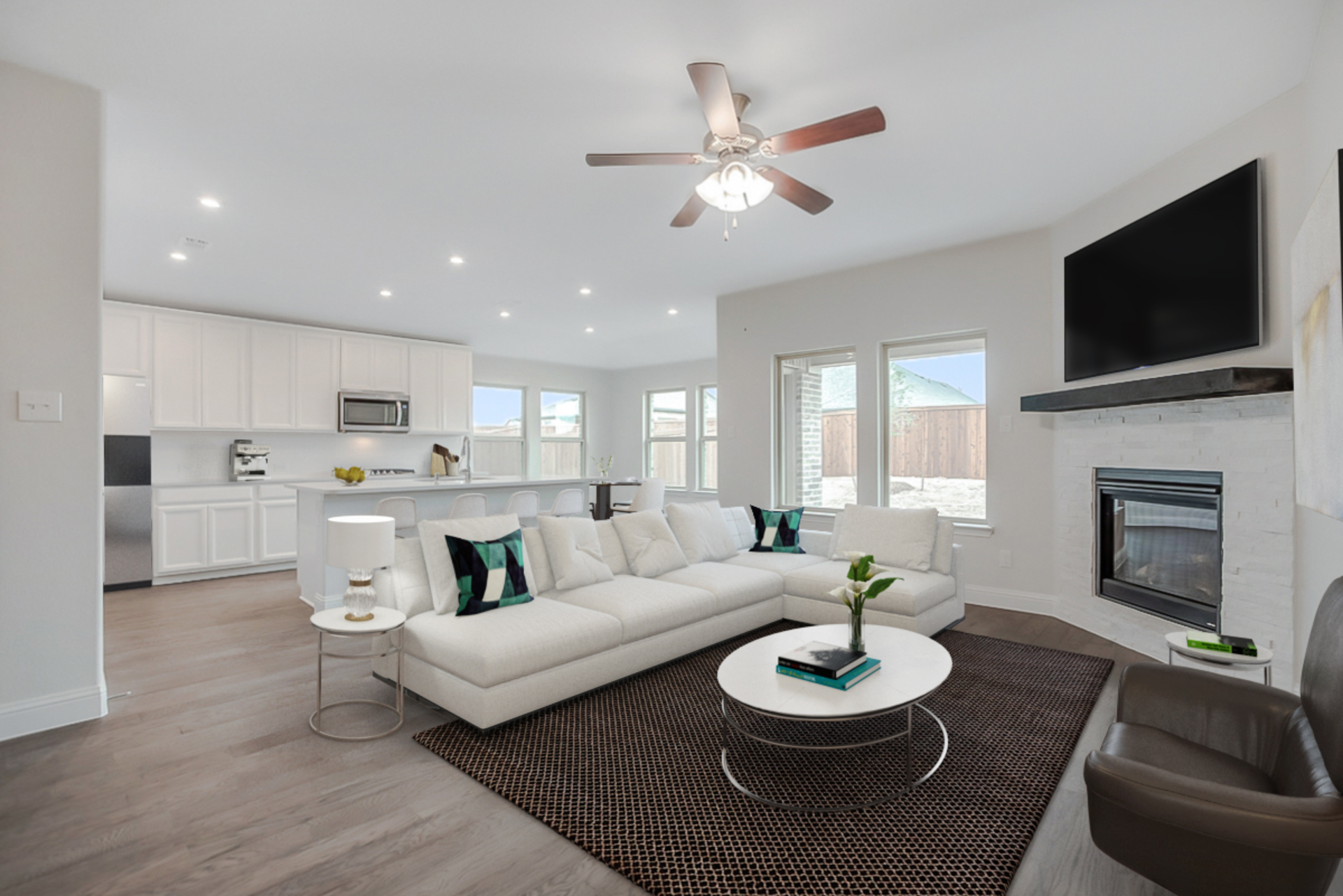 great room with large windows and wood floors