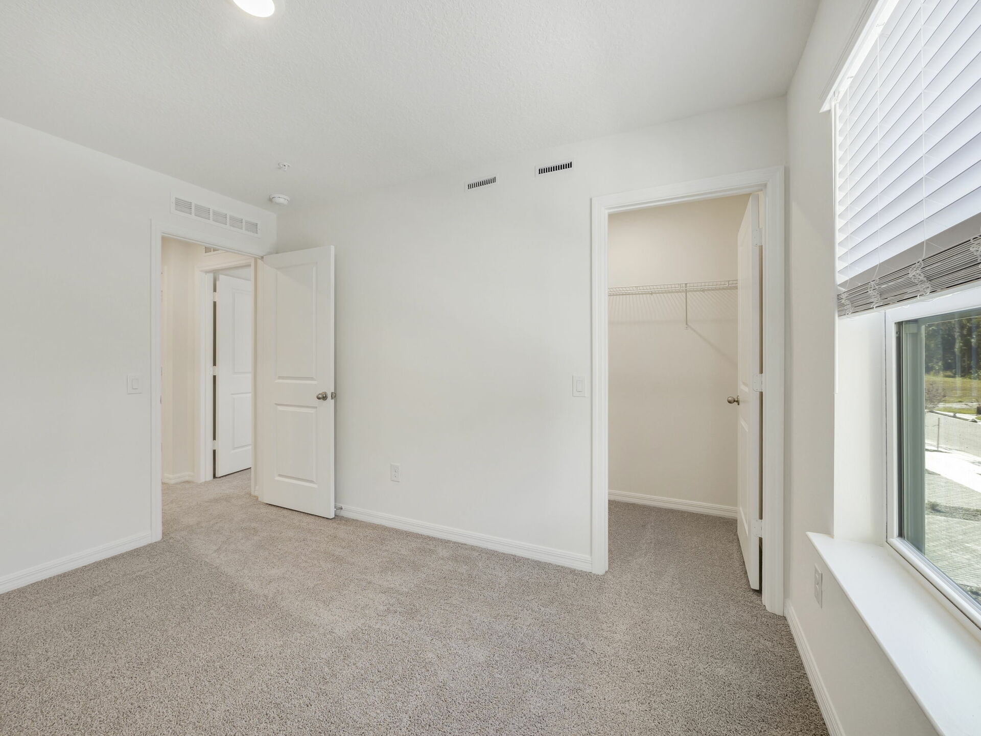 bedroom with carpet throughout and access to the closet