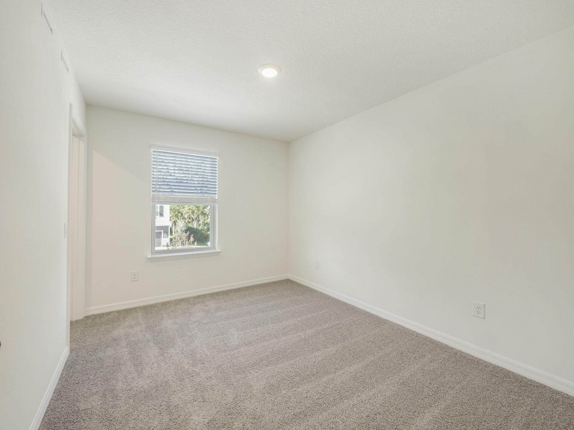 bedroom with carpet throughout and access to the closet