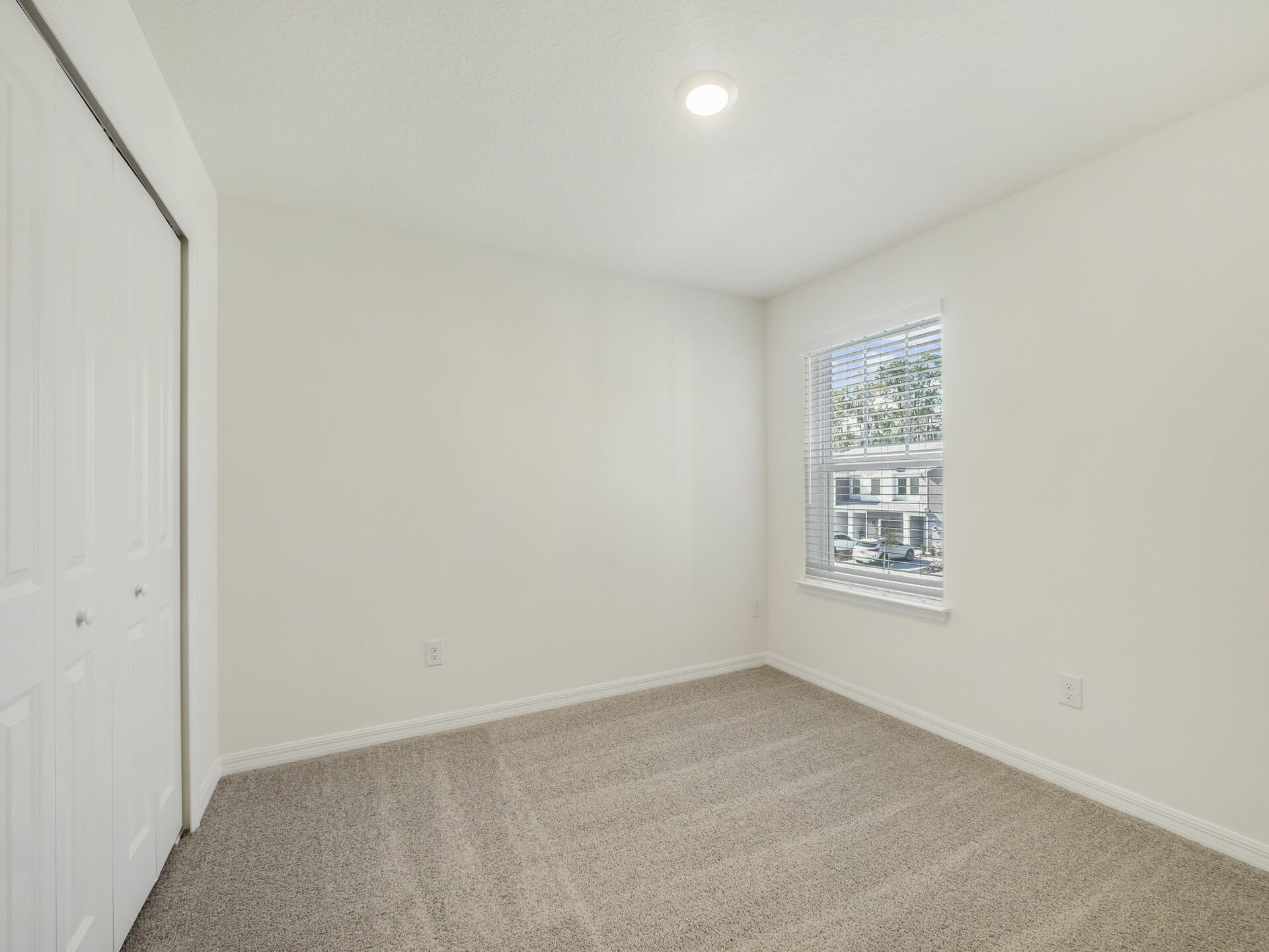 bedroom with carpet and access to the closet