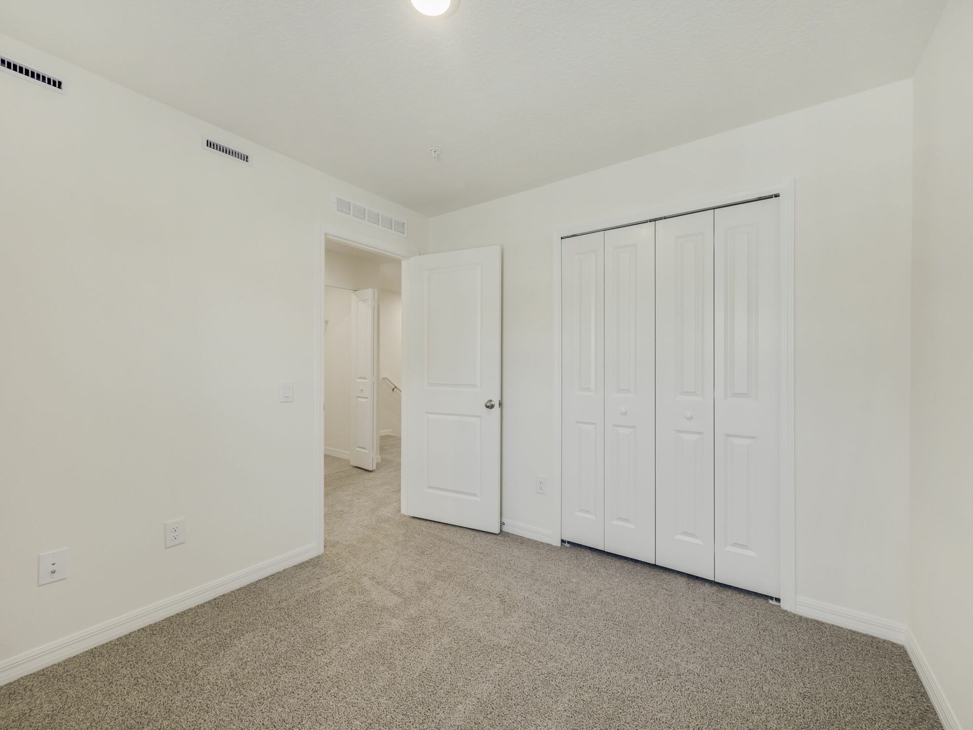 bedroom with carpet and access to the closet