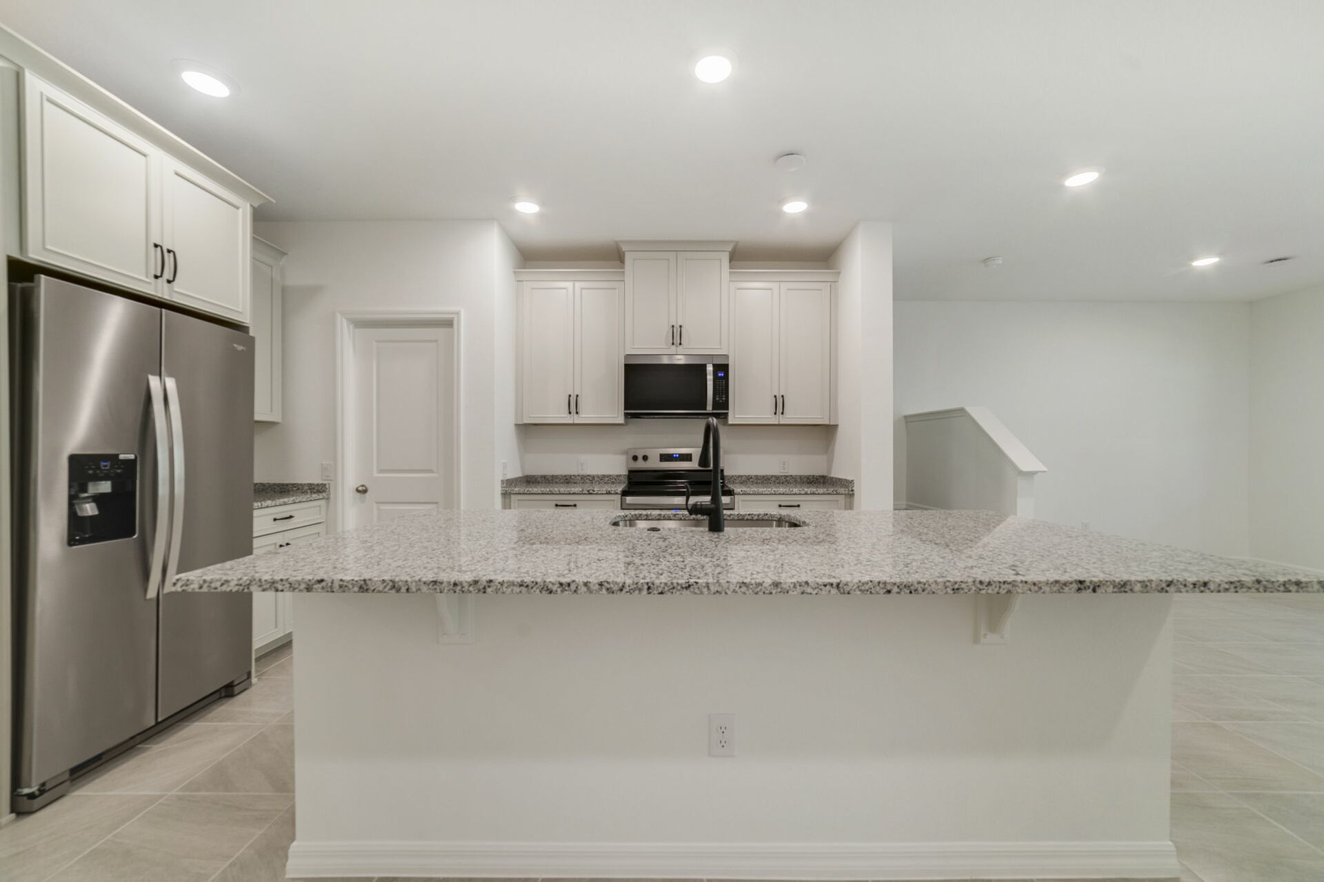 kitchen with view of center island and great room