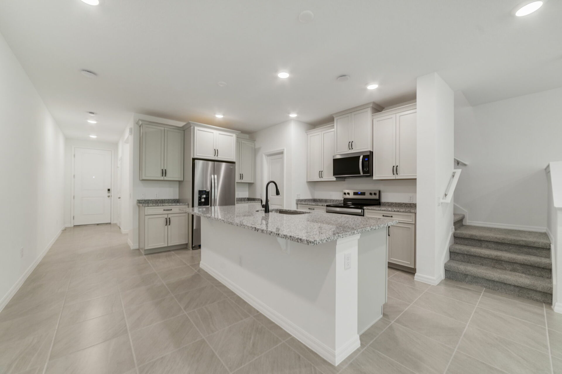 kitchen with view of center island and great room
