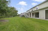covered patio and back yard