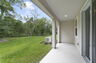 covered patio and back yard