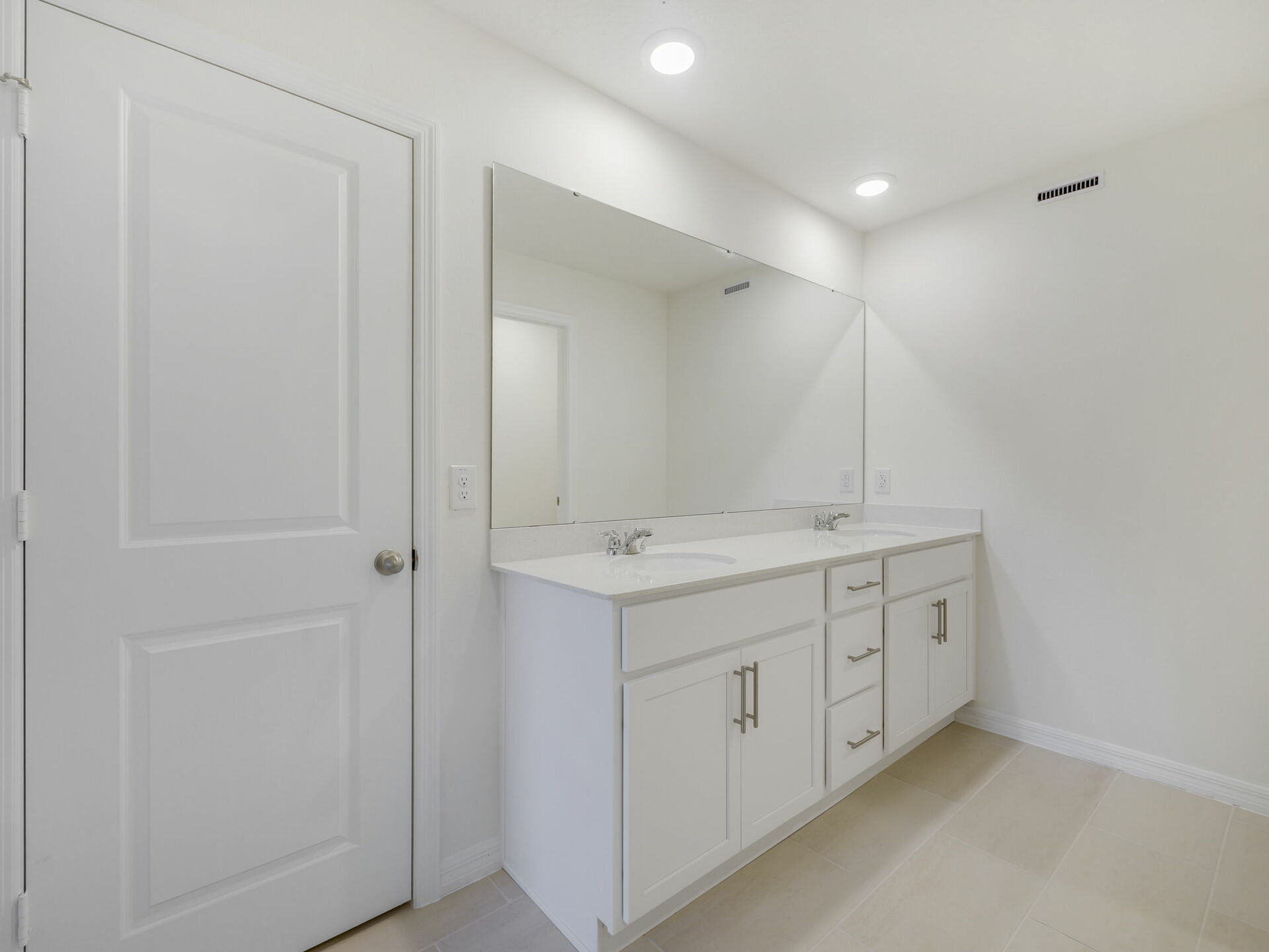 dual sink vanity with water closet and shower