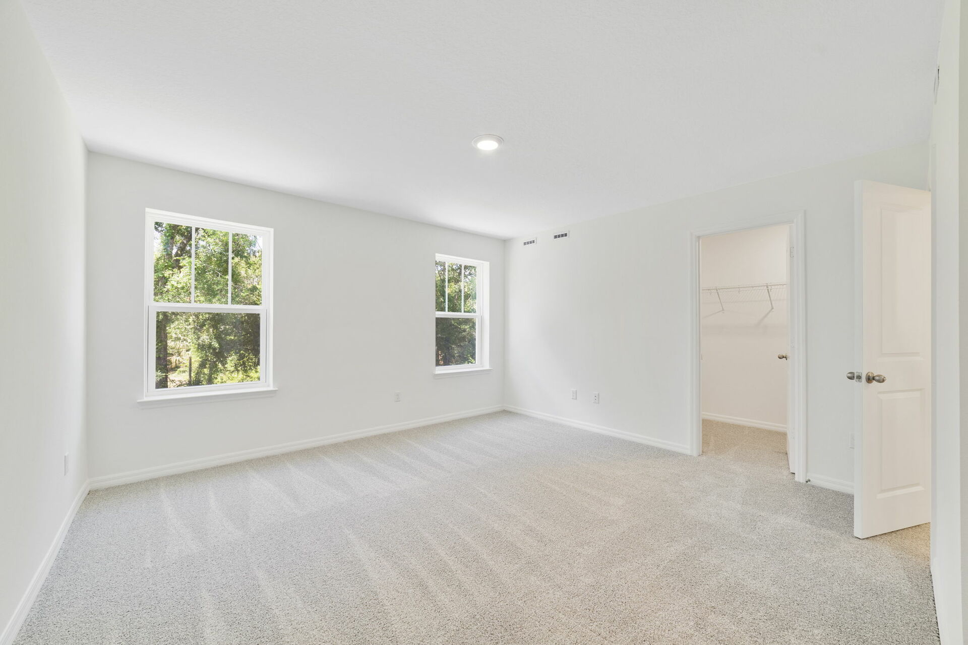 carpet throughout with dual windows and access to primary bathroom