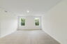 carpet throughout and multiple windows