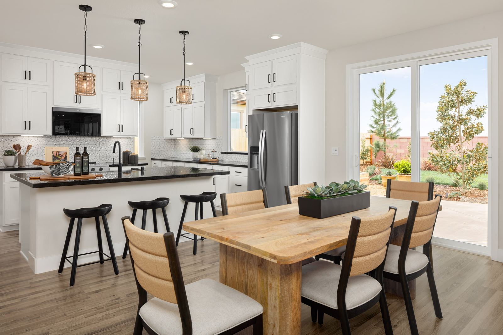 kitchen with white cabinets and black counters