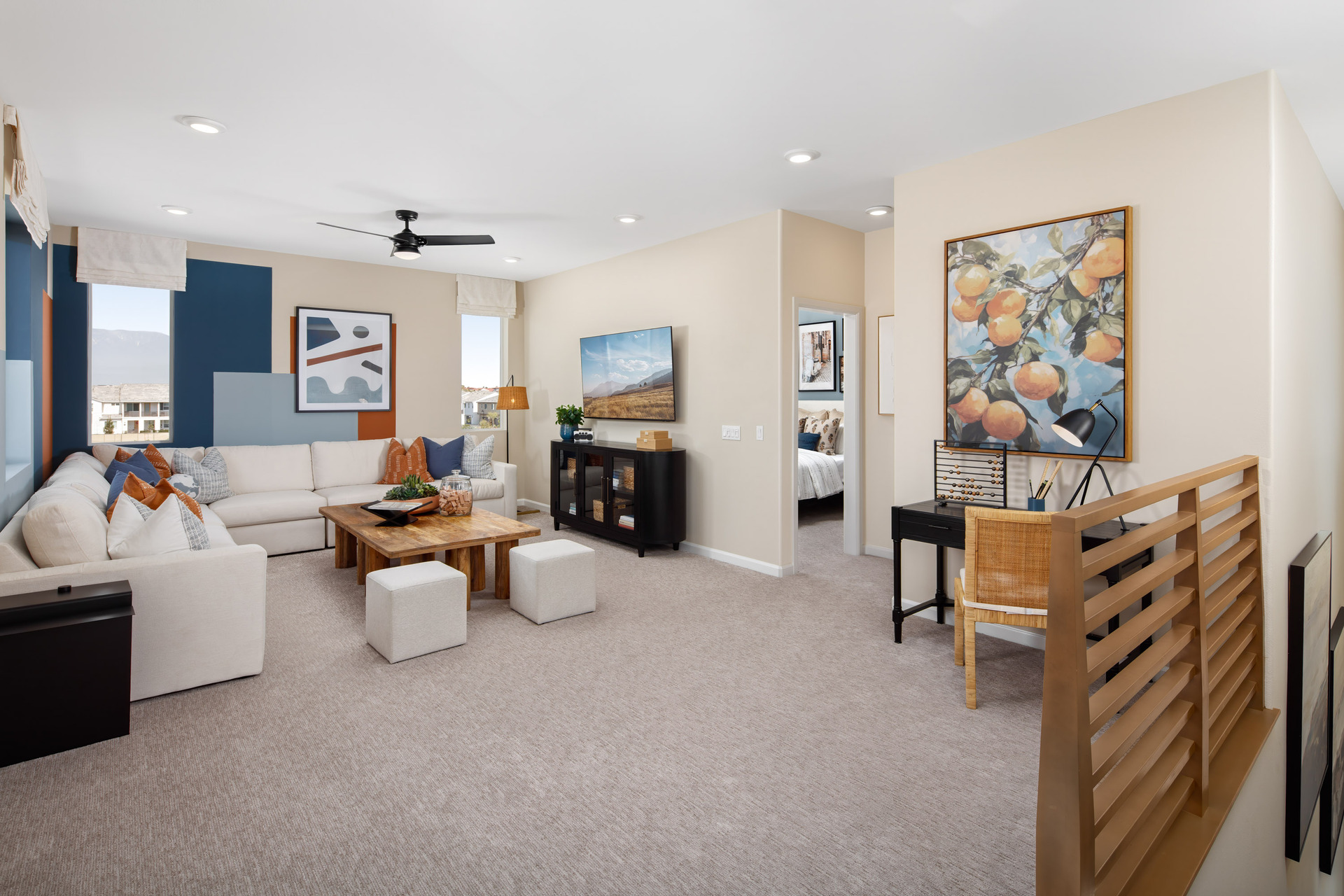loft with neutral carpet and large windows