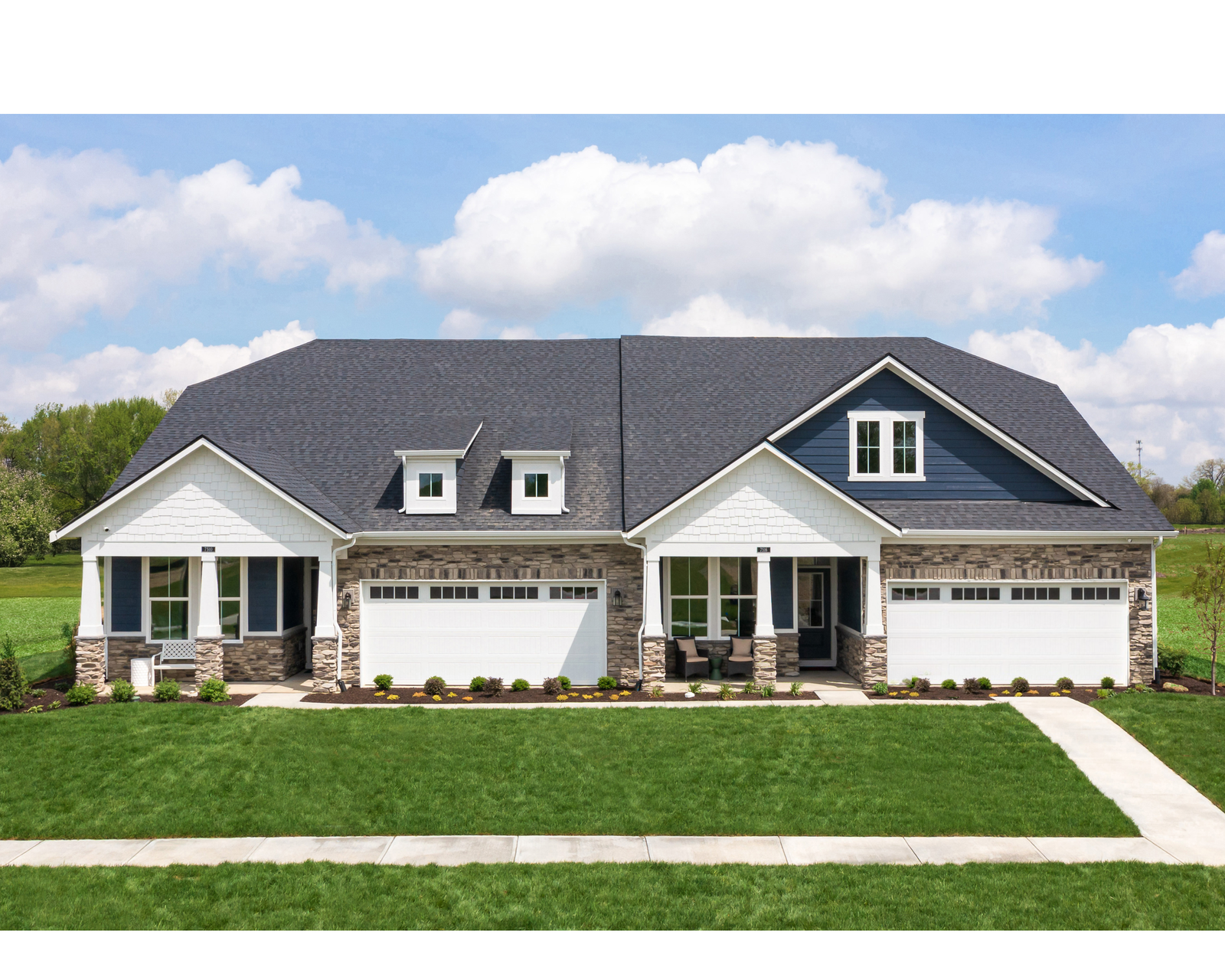 home with two entryways and brick accents