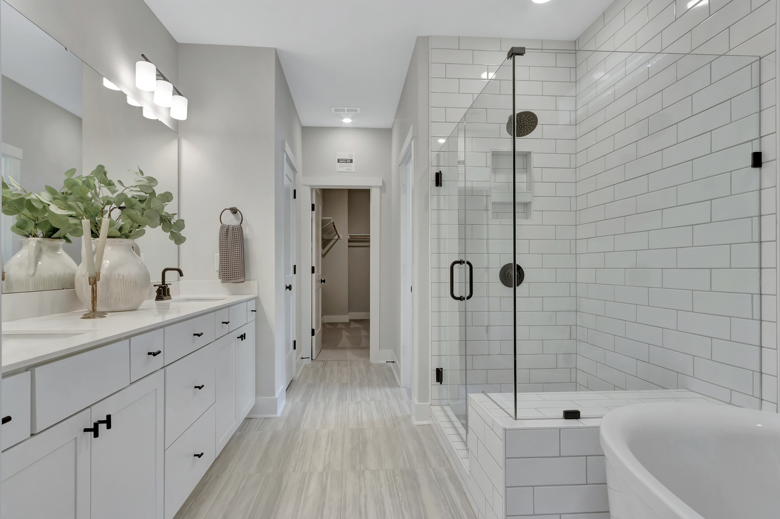 primary bathroom with shower and free standing tub