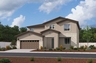 two-story exterior with a brown windowed garage and a cream brick trim over the study window