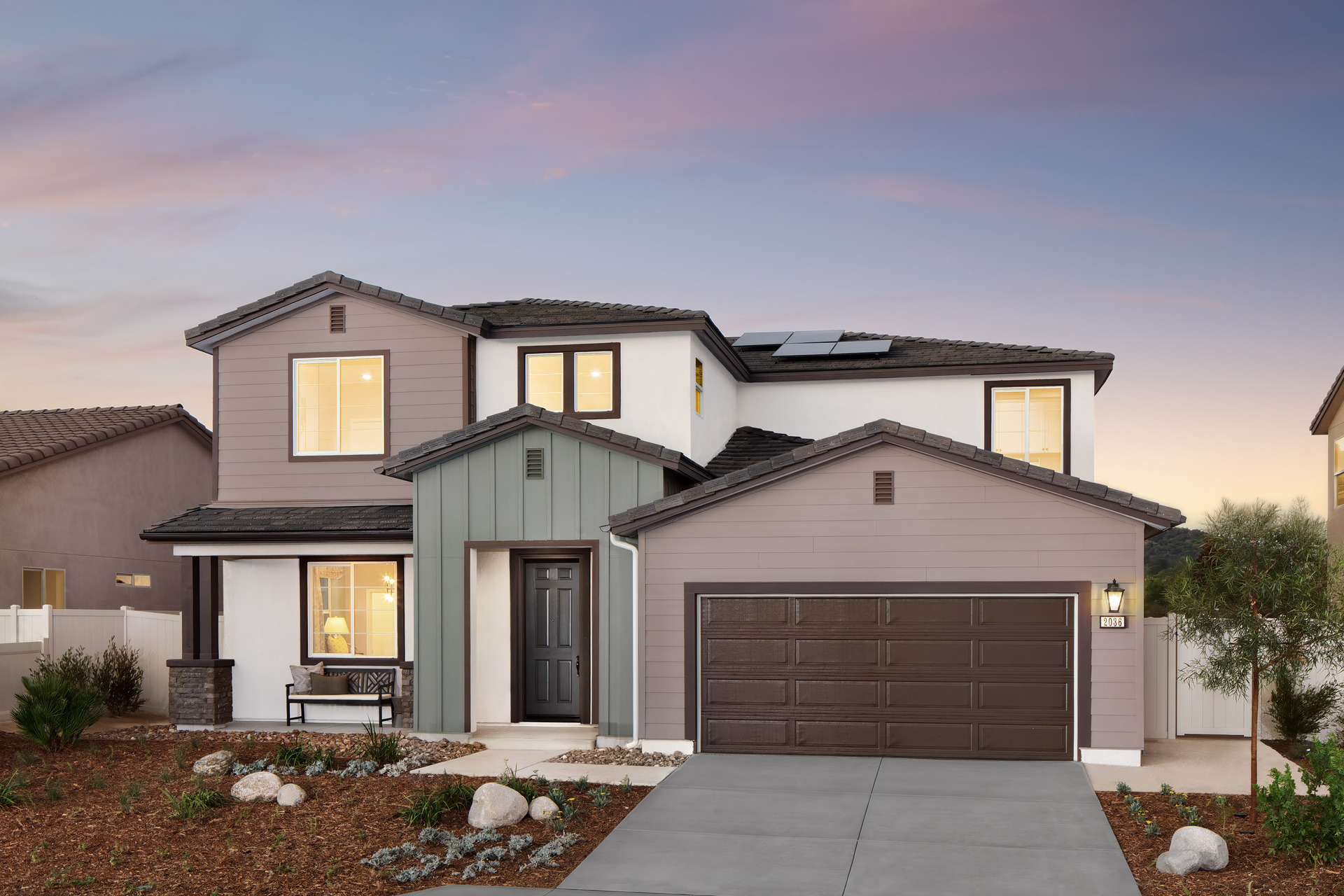 multicolored two-story exterior with a brown windowless garage