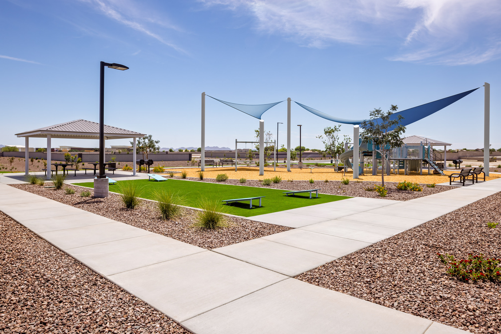 park with jungle gym and cornhole 
