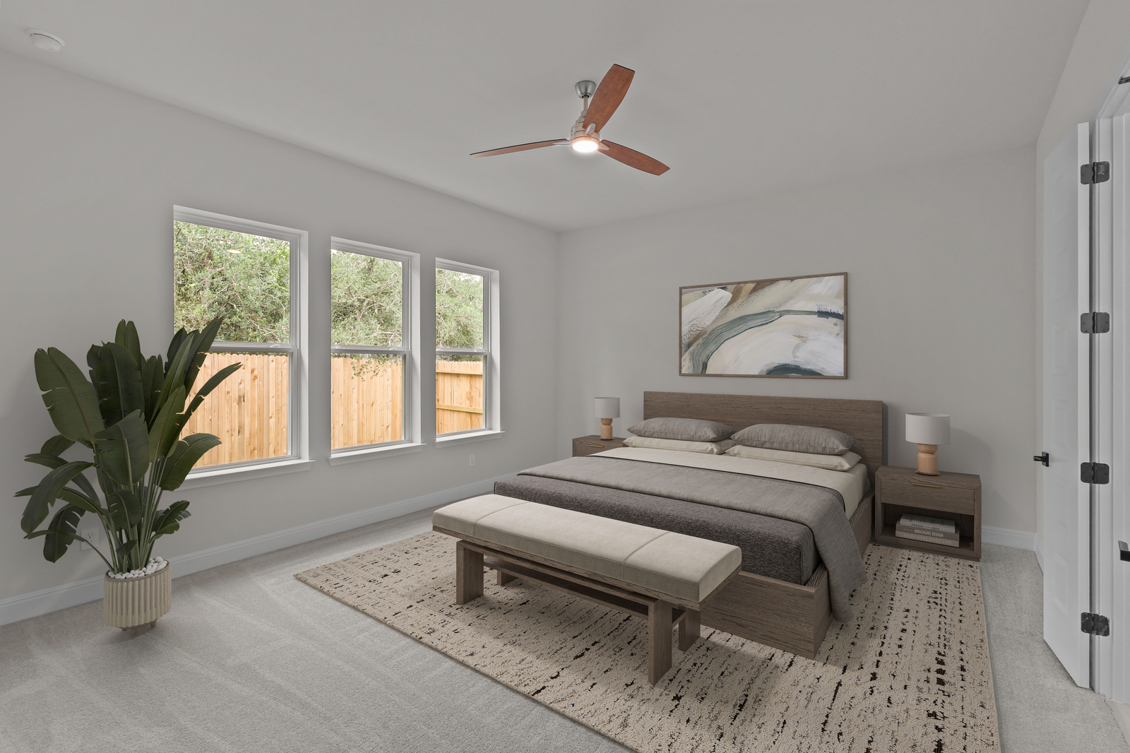 bedroom with carpet, windows & a ceiling fan