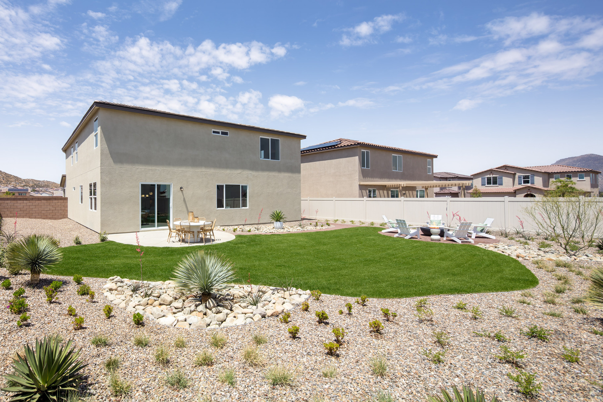 backyard with desert landscaping and seating area