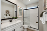 bathroom with white counters and countertops