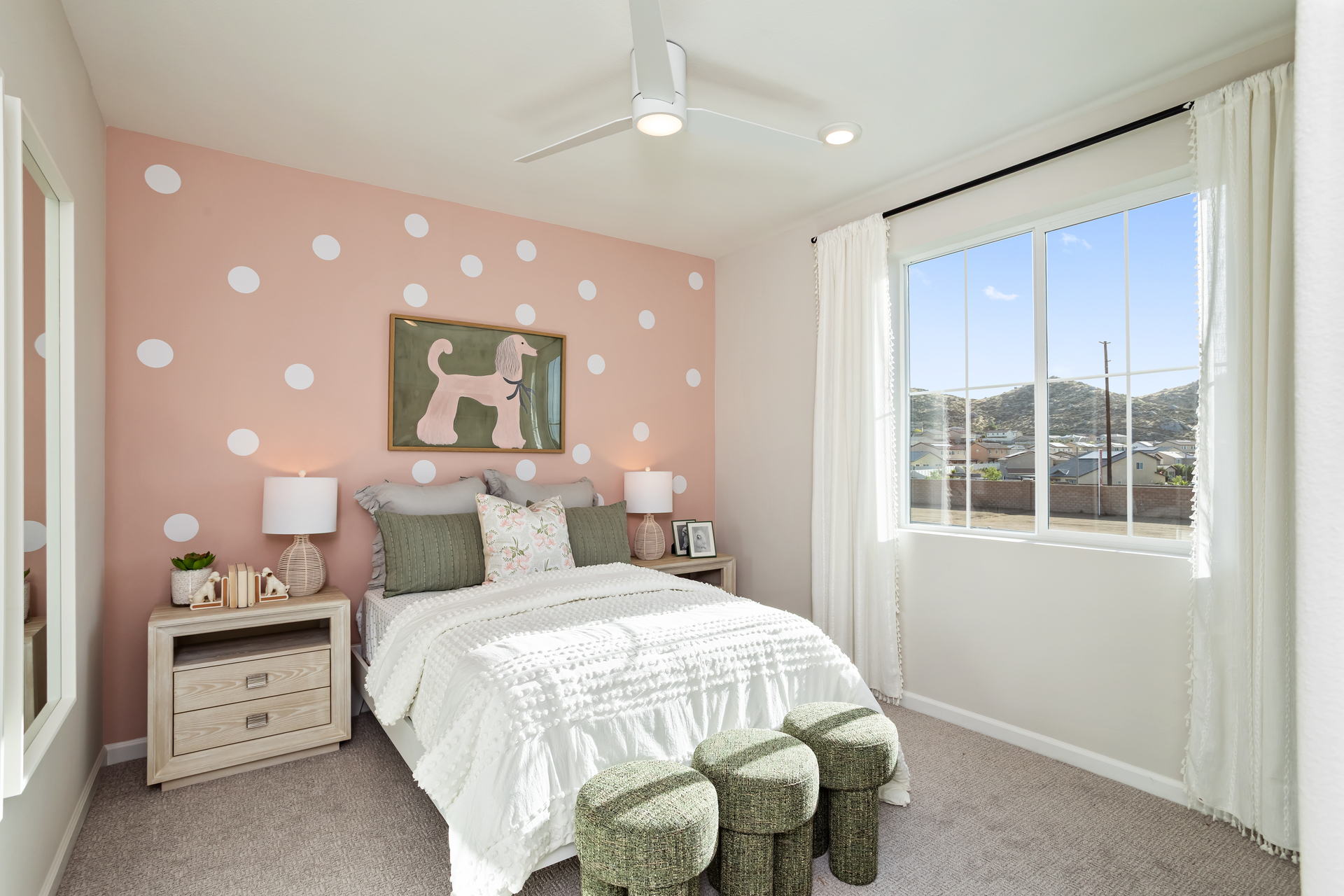 bedroom with accent wall and neutral floors