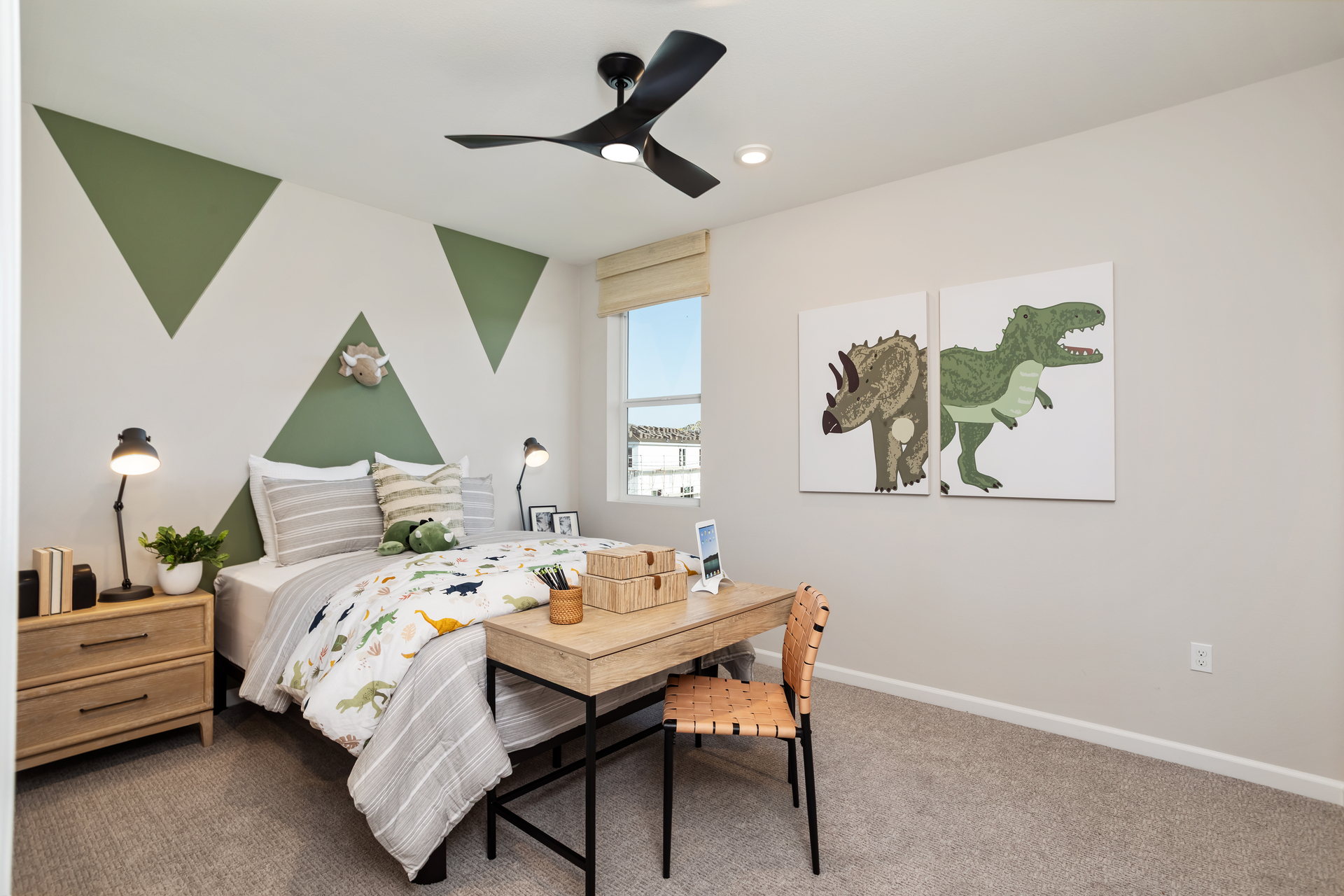 bedroom with accent wall and neutral floors
