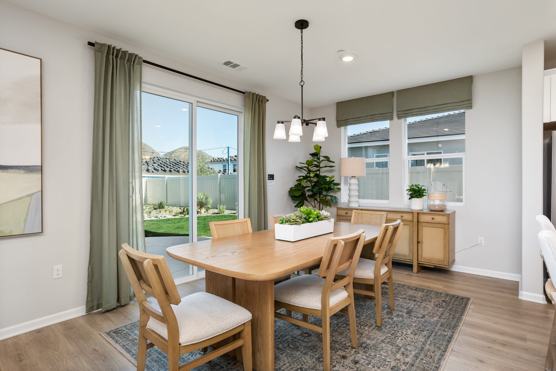 dining area with neutral floors and large windows
