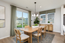 dining area with neutral floors and large windows