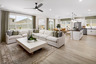 great room with neutral floors and large windows
