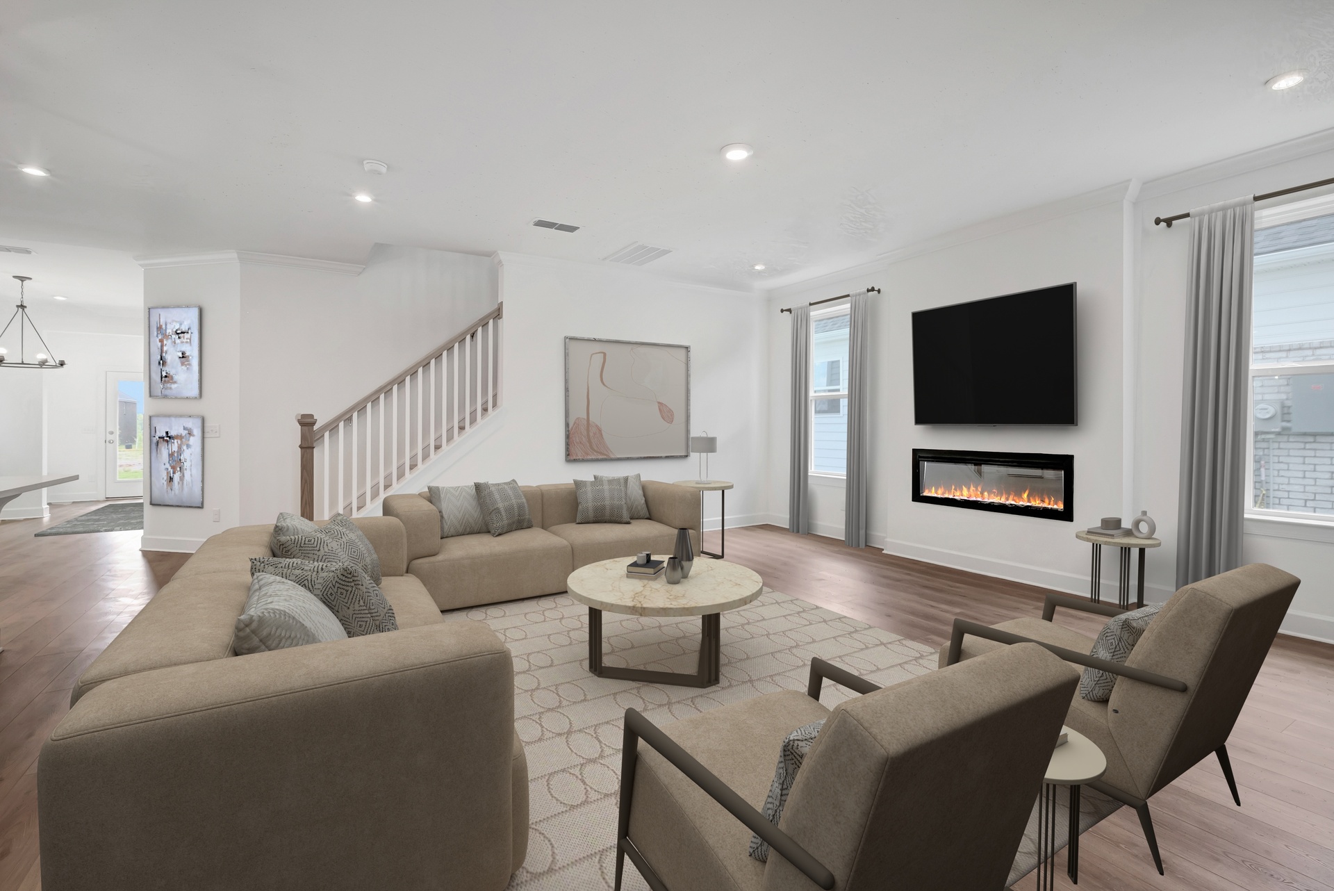 great room with wood flooring, large windows, a fireplace, and a view of the dining room