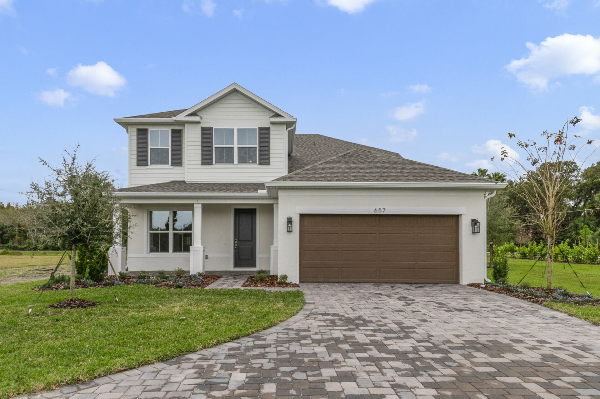 front exterior of home with stone driveway