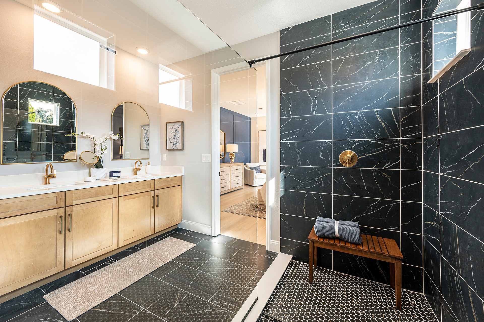 dual sink vanity with oversized shower and large mirrors
