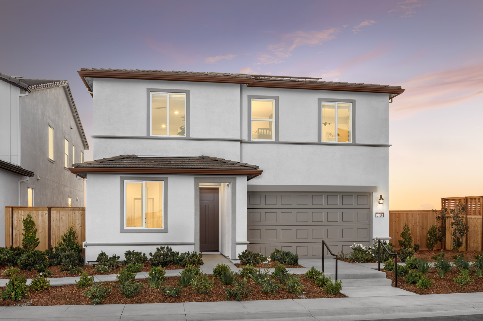 front exterior of two-story light gray modern home
